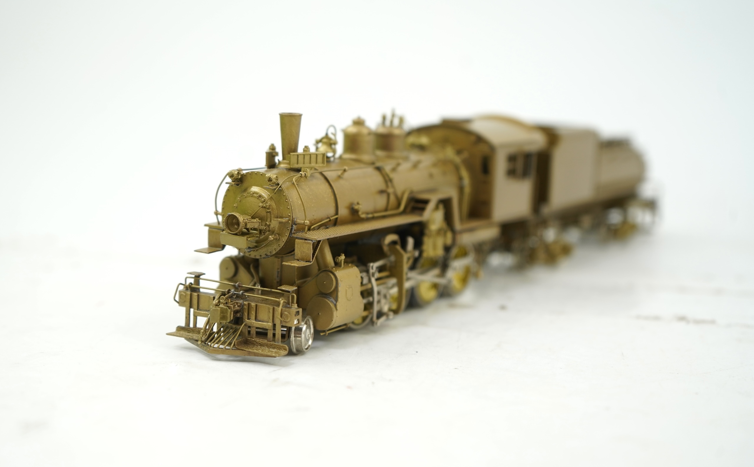 A boxed HO gauge Overland Models Inc. J.P.M. unpainted brass model of Union Pacific Railway C-57, 2-8-0 locomotive with bogie tender, powered for two rail operation.
